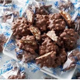 Mascot gift box presentation showcasing premium pecan clusters for gifting.