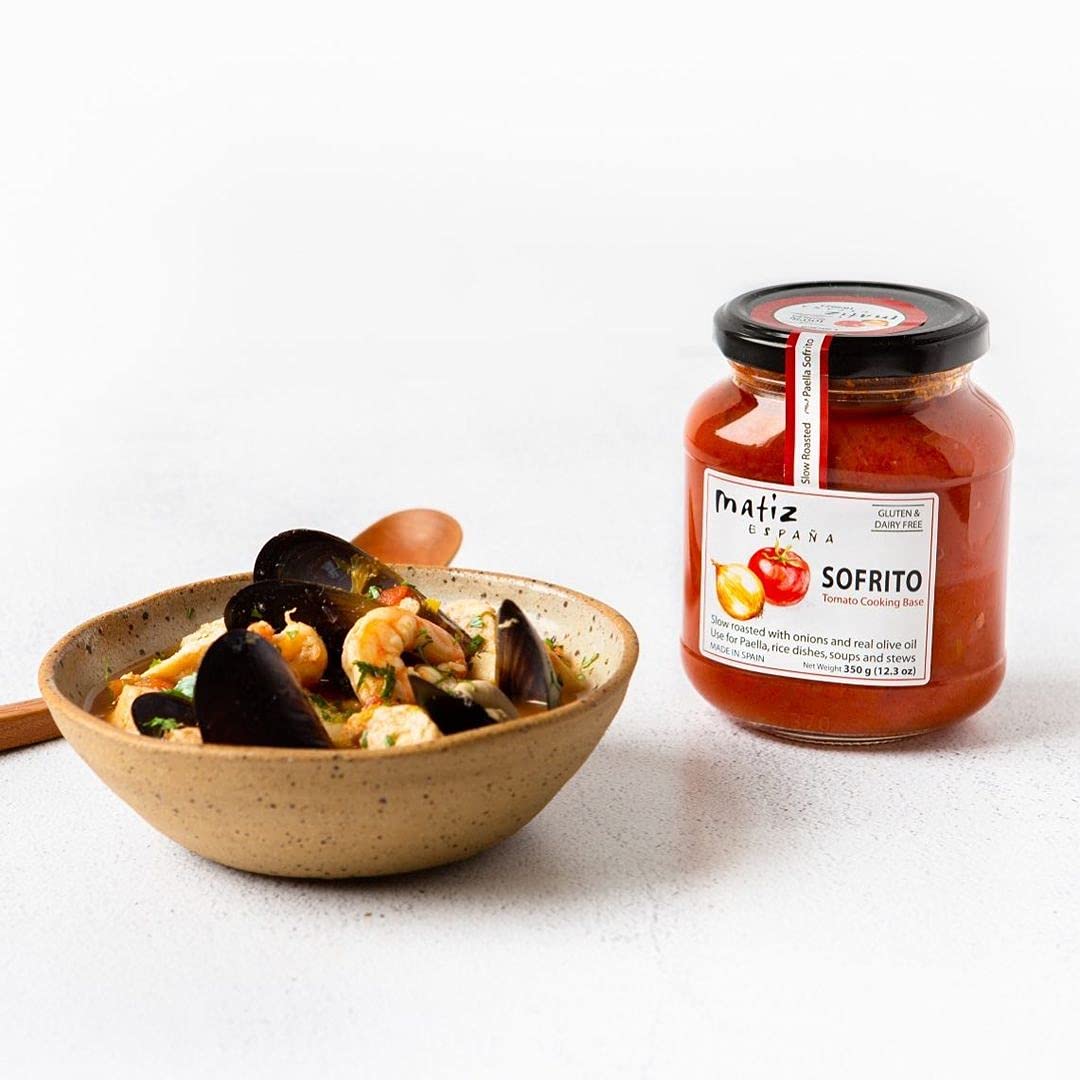 Matiz Sofrito ingredient overview with tomatoes, onion, garlic.
