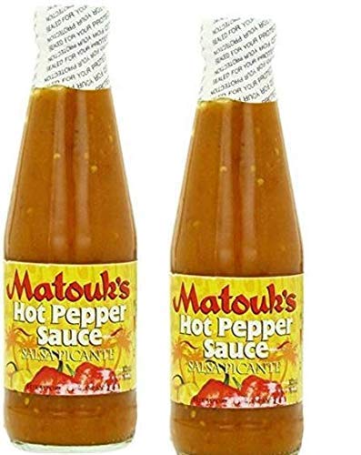 Matouk's hot pepper sauce bottle ready to pour on grilled seafood for bold flavor