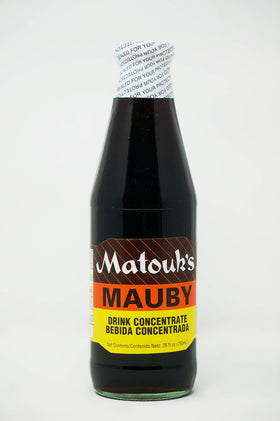 Matouk's Mauby bottle close-up with rich amber color for a refreshing classic.
