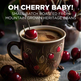 Maud's cherry pod with steaming cup highlights fruity aroma and smooth brew.