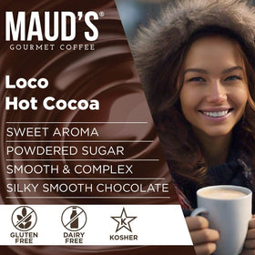 Maud's Dark Hot Chocolate instant packets with dairy-free topping in a cup.