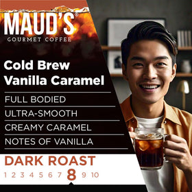 Maud’s Vanilla Caramel coffee cup steaming with inviting aroma.