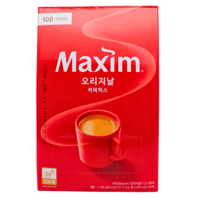 Close-up of Maxim Original Coffee Mix sachets for quick caffeine boost.