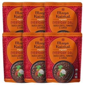 Maya Kaimal black lentil dal bowl with tomato and cumin, comforting and protein-rich.