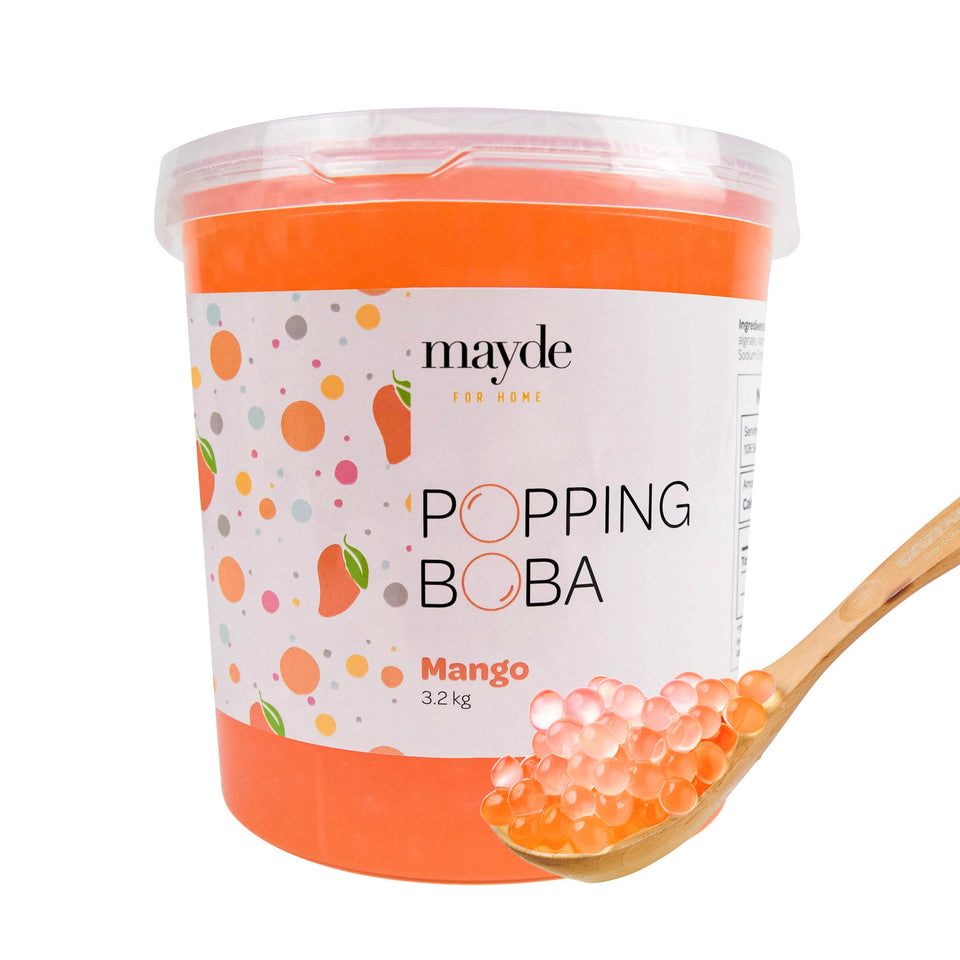 Mayde mango popping boba pearls in a tub add fruity flavor to bubble tea.