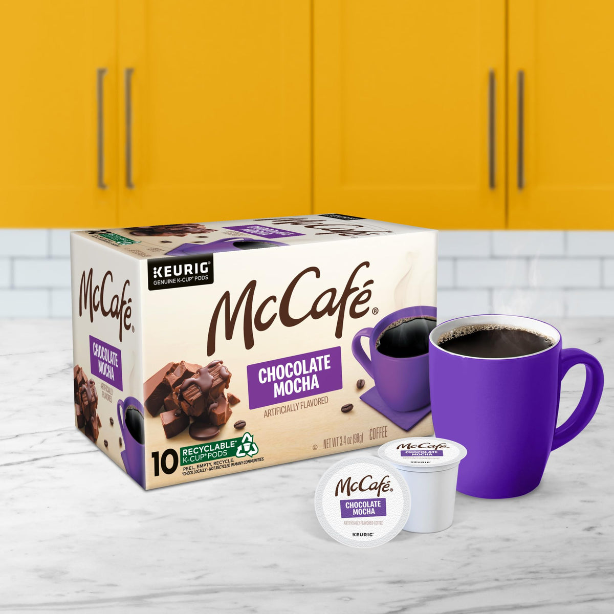 McCafé Chocolate Mocha K-Cup pod on recyclable materials, eco-friendly.
