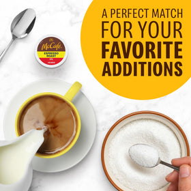 McCafe Espresso Roast K-Cup pod held in hand for quick cafe-grade coffee.