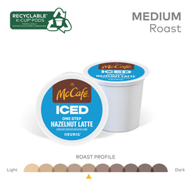 Pouring McCafe Iced Hazelnut Latte over ice for a refreshing cold drink