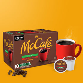 McCafé pods beside a Keurig machine highlighting single serve compatibility