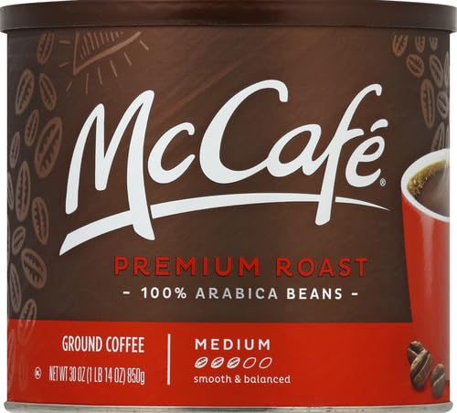 McCafé Premium Roast ground coffee being measured for a perfect cup.