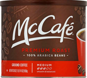 McCafé Premium Roast ground coffee being measured for a perfect cup.