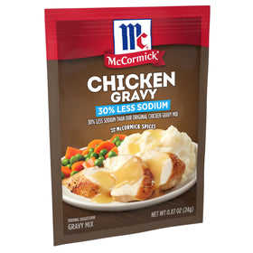 McCormick 30% Less Sodium Chicken Gravy Mix packets on a shelf for easy weeknight meals.