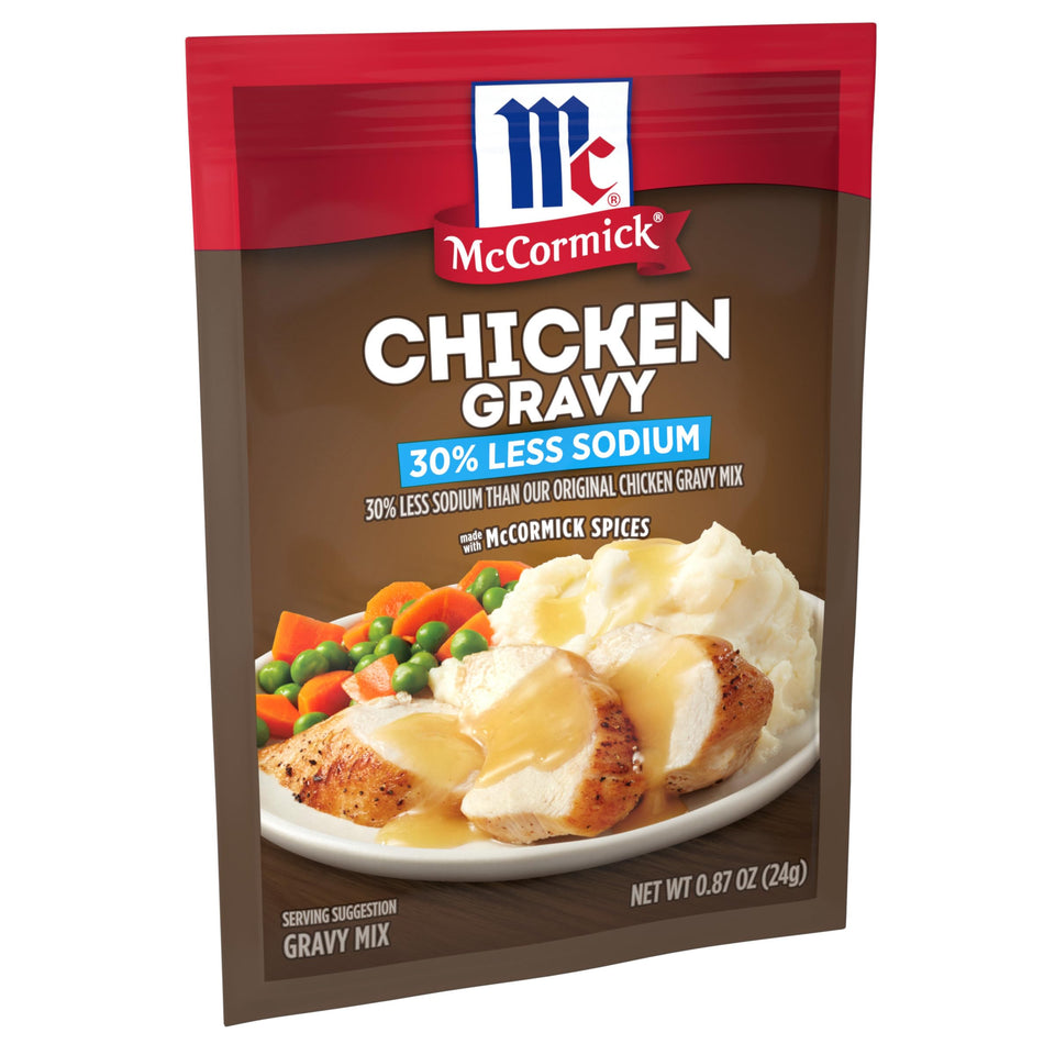 McCormick 30% Less Sodium Chicken Gravy Mix packets on a shelf for easy weeknight meals.