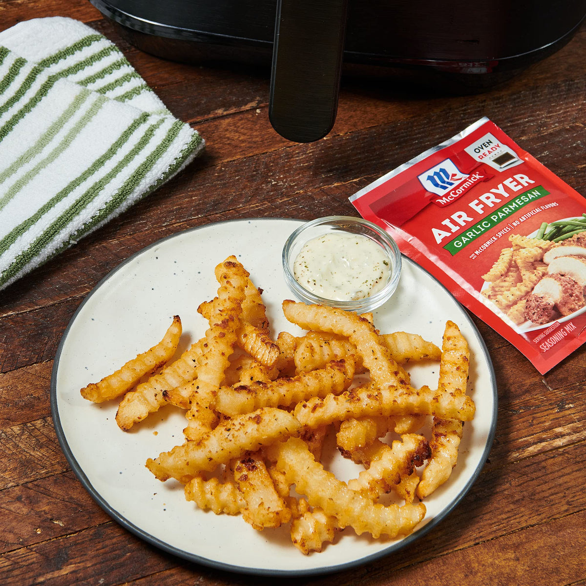 Family dinner setup using McCormick Garlic Parmesan Seasoning.