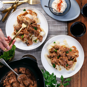 Seasoning sprinkled into pan for creamy beef stroganoff.
