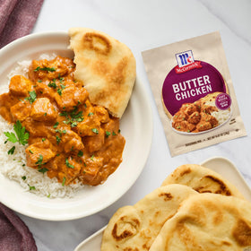 McCormick Butter Chicken browning-chicken in pan for quick meal prep.