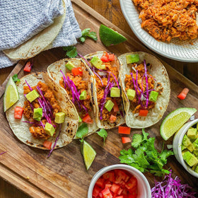 McCormick Classic Taco Seasoning Mild on a kitchen counter with fresh ingredients