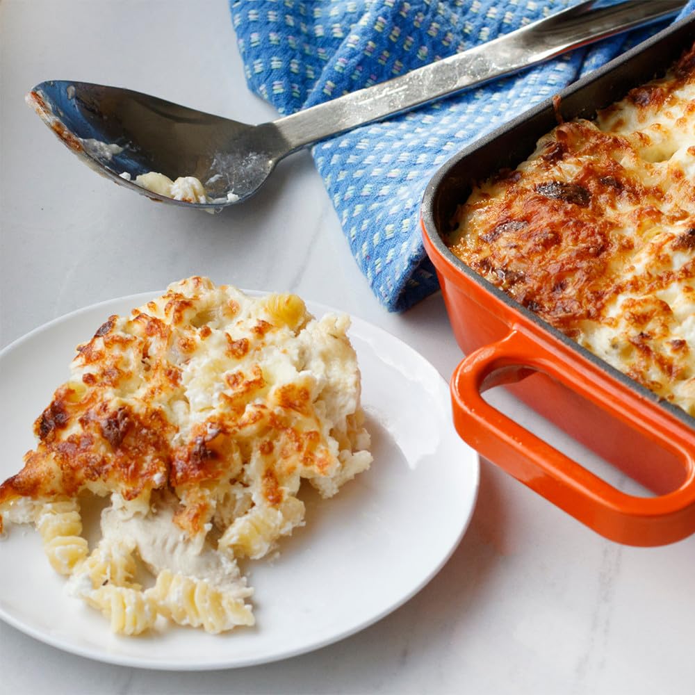 Milk and butter warming with McCormick Alfredo mix creates a creamy sauce.