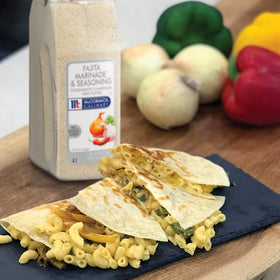 McCormick Culinary fajita seasoning sprinkled on vegetables for vibrant notes.