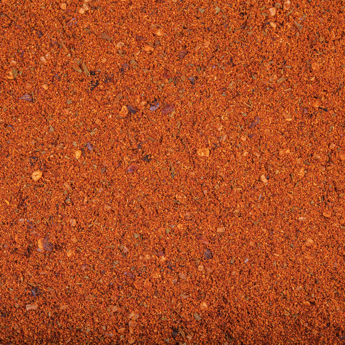 Hummus dip served with Harissa for a versatile condiment option