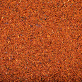 Hummus dip served with Harissa for a versatile condiment option