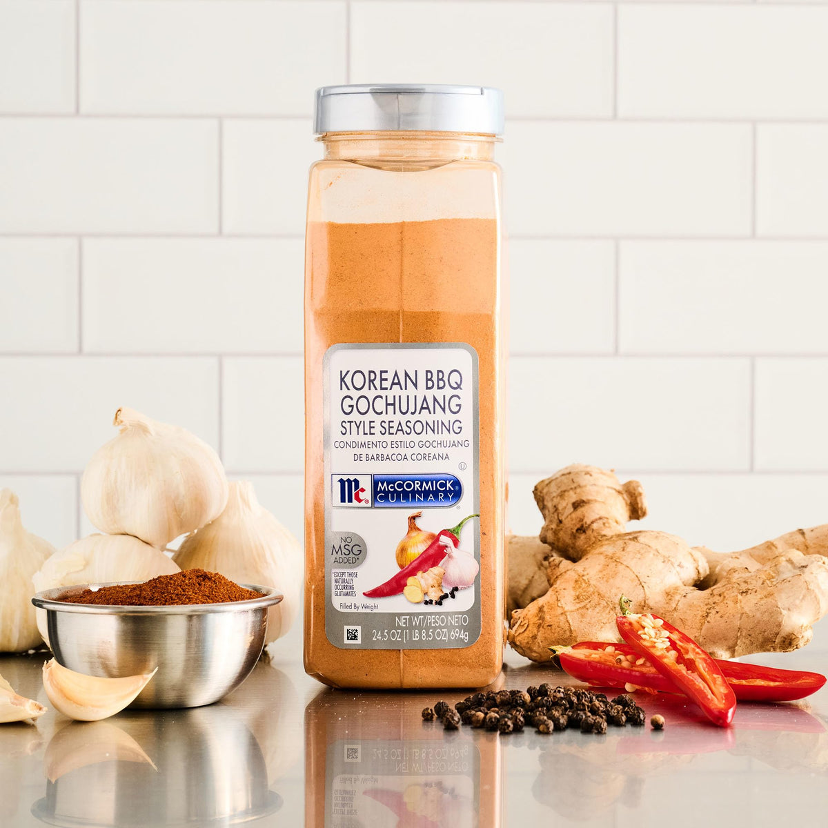 Bottle pouring over grilled shrimp to emphasize craveable, balanced heat.