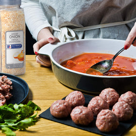 Casserole prep scene with McCormick Culinary Minced Onion emphasizes time-saving prep.