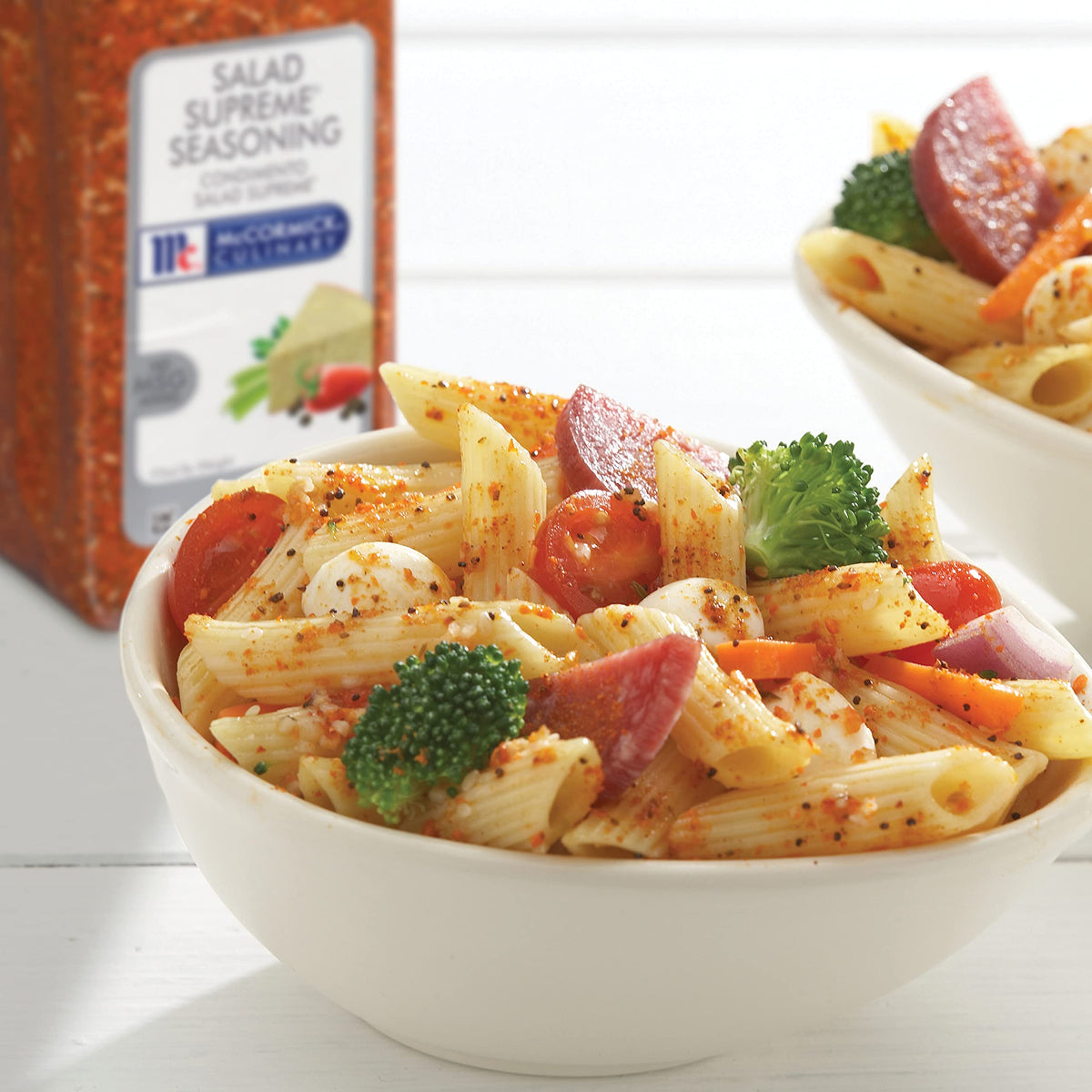 McCormick Culinary Salad Supreme on pasta salad with crisp vegetables.