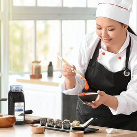 Toasted McCormick Culinary black sesame seeds release aroma, elevating Asian dishes.