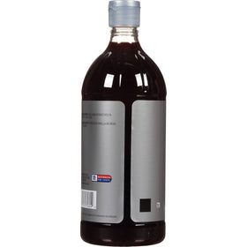 Pour-spout close-up of McCormick Culinary Vanilla Extract for precise dispensing