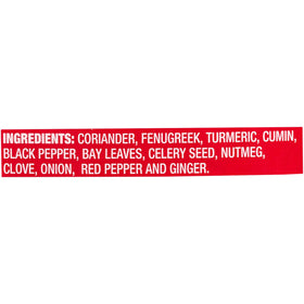McCormick Curry Powder bottle angled in kitchen, versatile seasoning for meats and vegetables.