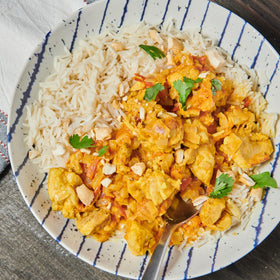 McCormick Curry Powder being poured, instantly elevates curries and chicken dishes.