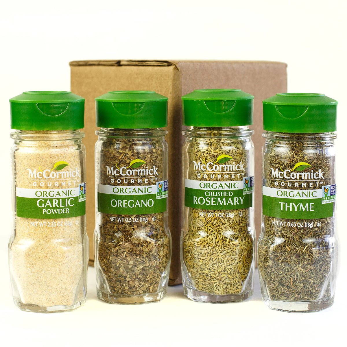 McCormick Gourmet Organic spice set beside roasted chicken for effortless herb seasoning.