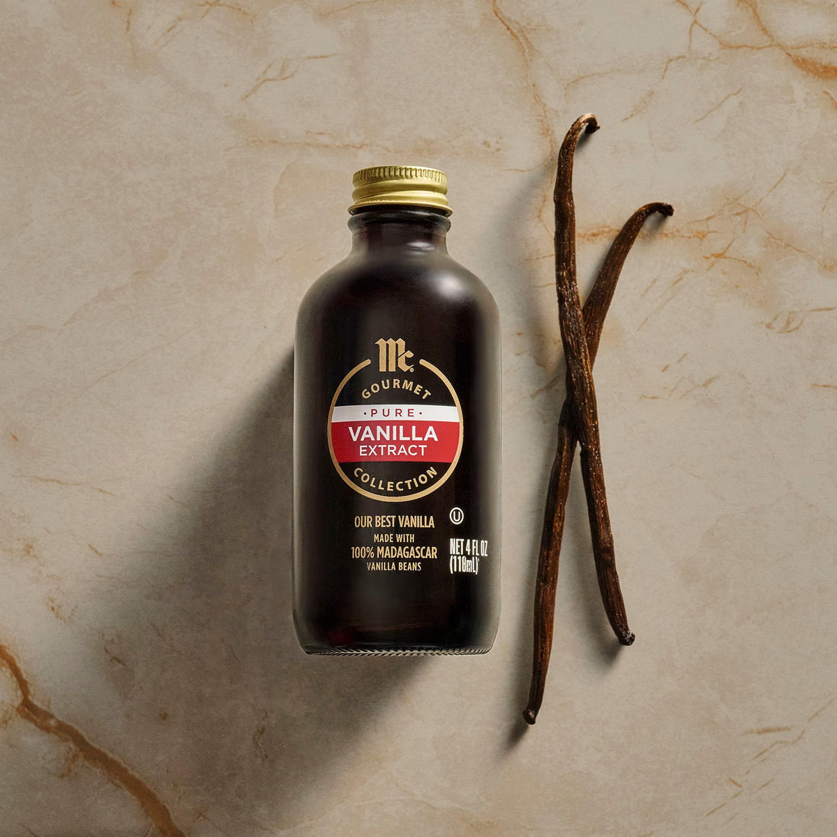 Glass jar of vanilla extract on a tidy kitchen counter