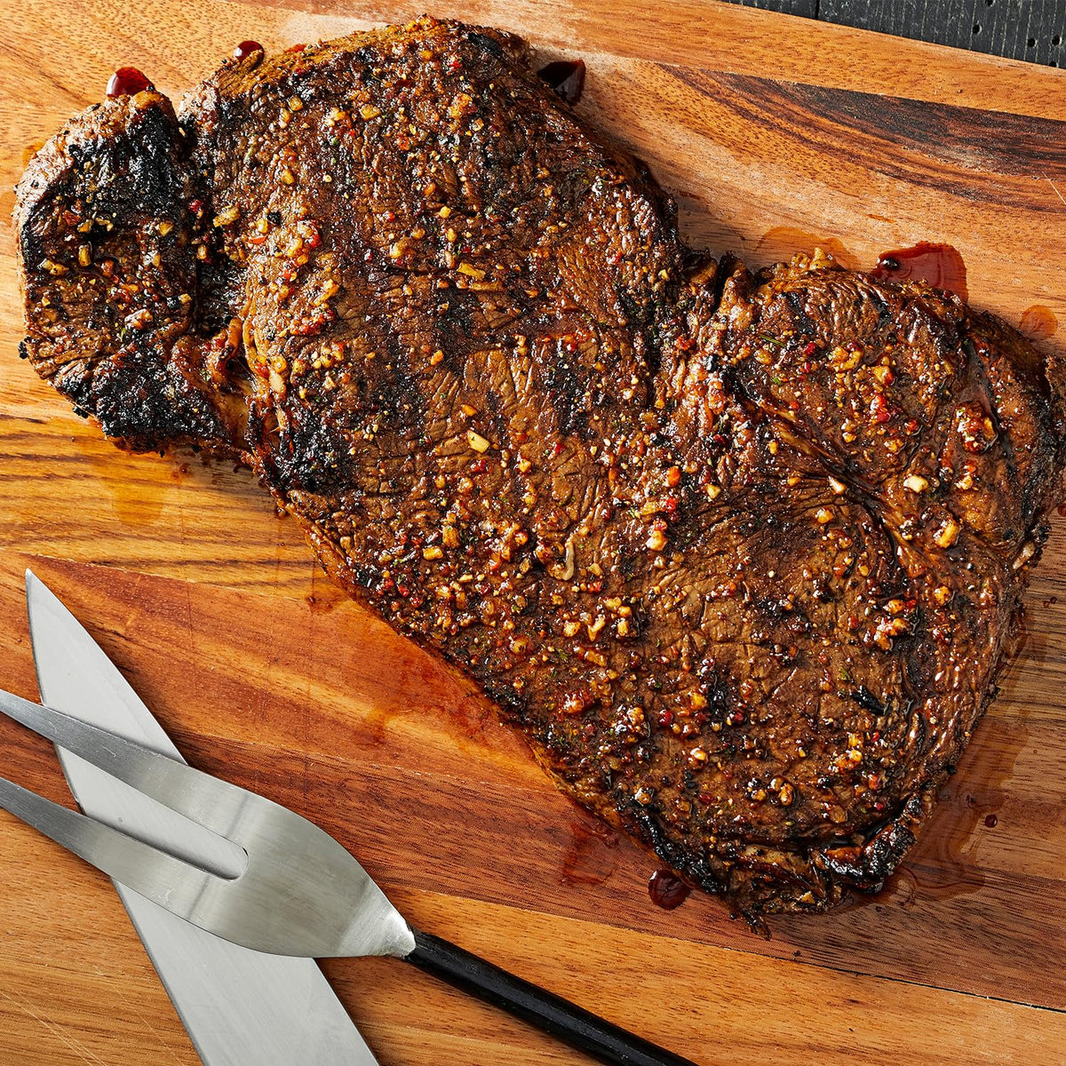 Grilling session using Memphis Pit Rub for Memphis-style aroma.