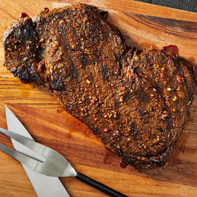 Grilling session using Memphis Pit Rub for Memphis-style aroma.