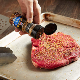 McCormick Grill Mates Roasted Garlic and Herb Seasoning bottle elevates vegetables and potatoes.