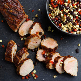 Pork roast marinating in McCormick Smokehouse Mesquite for bold flavor.
