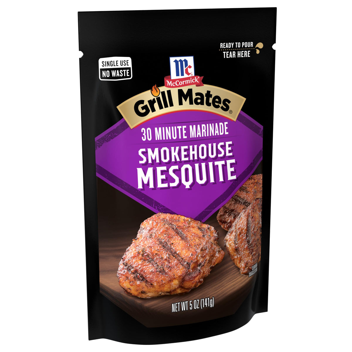 Tear and pour action showing McCormick Smokehouse Mesquite pouch for easy marination.