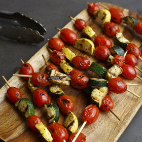 Grilling scene with McCormick Tomato Garlic Basil Marinade in backyard