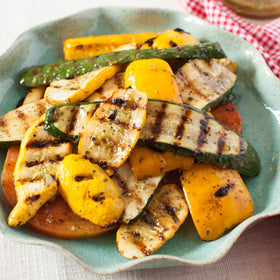 Chicken on the grill with McCormick Zesty Herb Marinade.