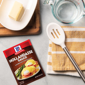 McCormick Hollandaise sauce mix poured over chicken for rich flavor.