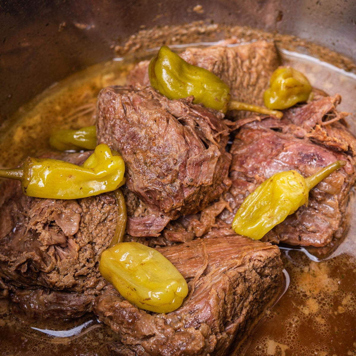 Butter melting with McCormick mix signals tender, flavorful roast results.