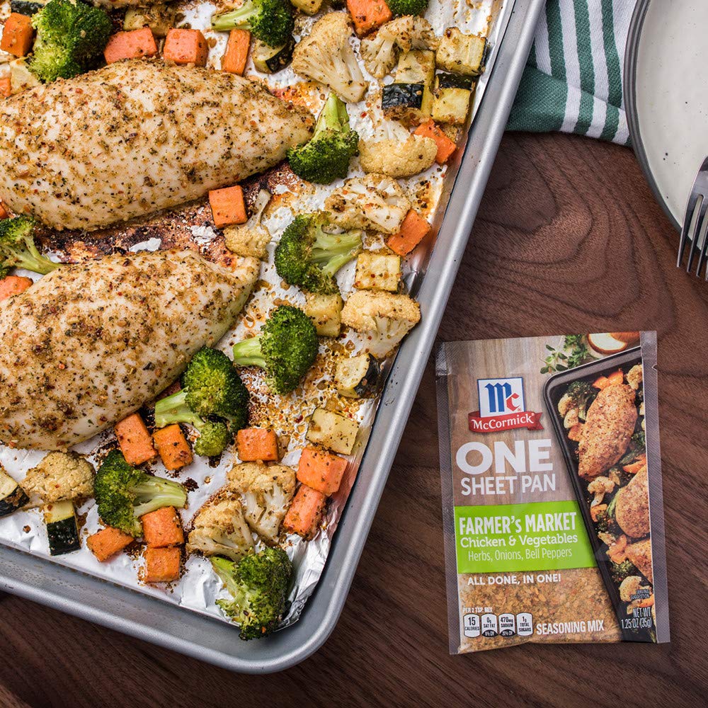 Plated McCormick sheet-pan meal served family-style on a rustic table.