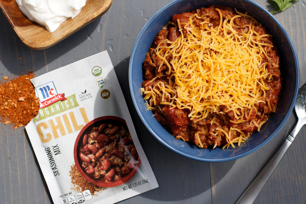 McCormick Organics Chili Seasoning Mix ingredients plate featuring peppers, cumin, oregano