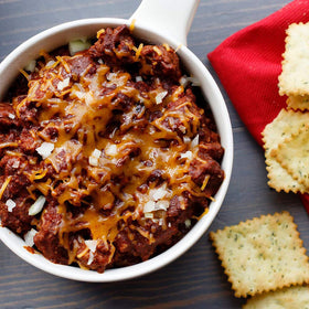 Stovetop scene with chili simmering, inviting aroma and texture