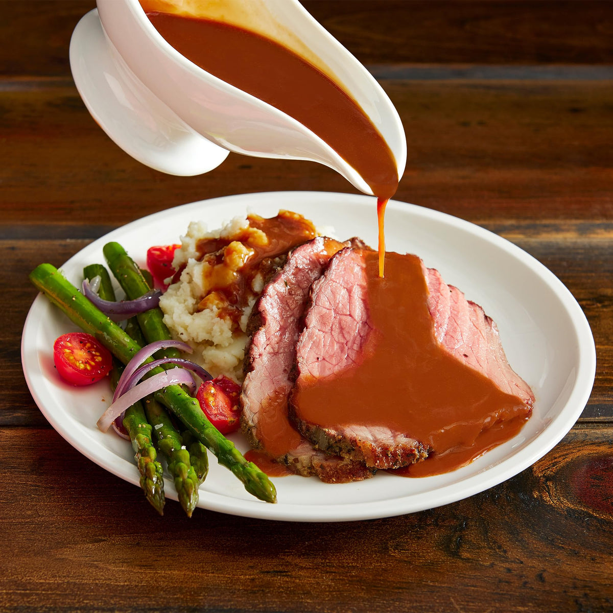 McCormick Poultry Gravy Mix plated serving pairs with potatoes and stuffing.