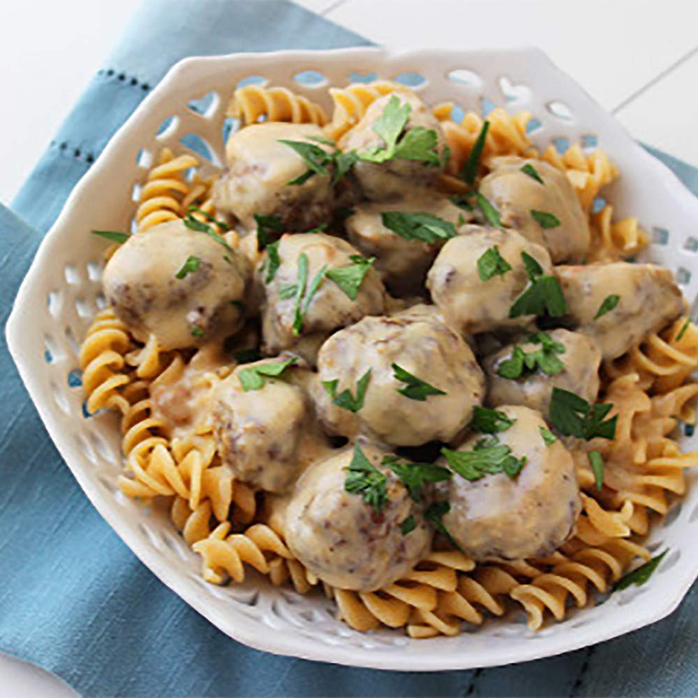 Creamy sauce simmering with McCormick Swedish Meatballs mix