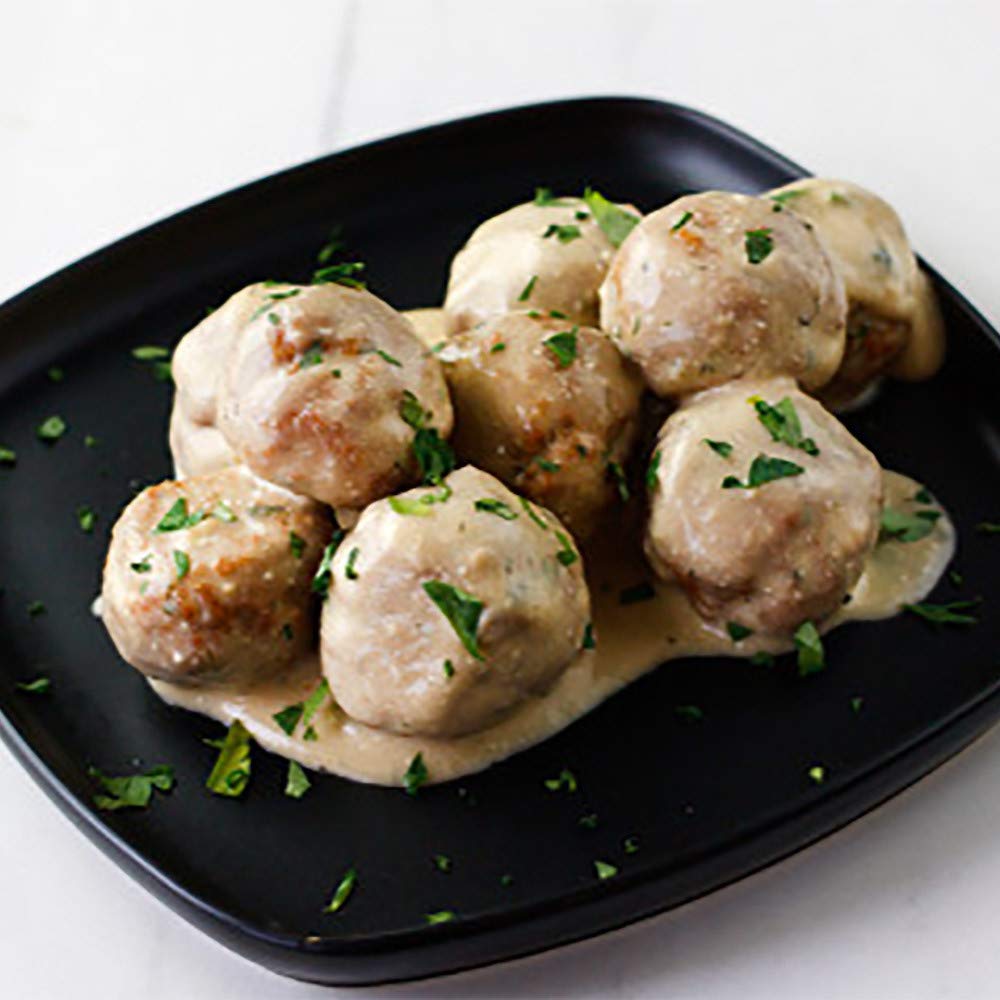 Served plate of Swedish meatballs over noodles with McCormick mix